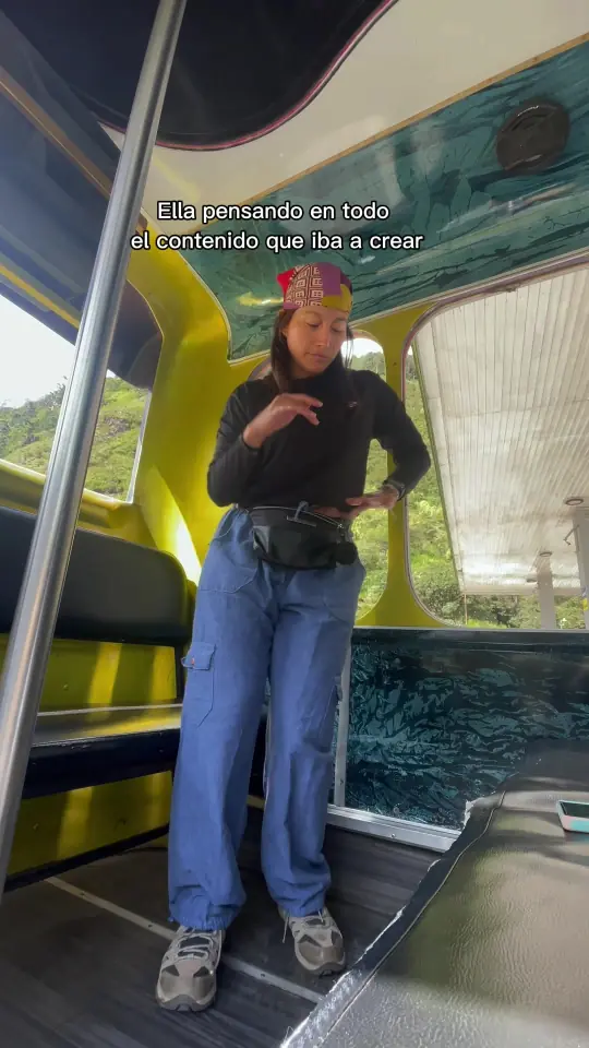 Video cover: a woman in a hat standing inside a tourist train carriage